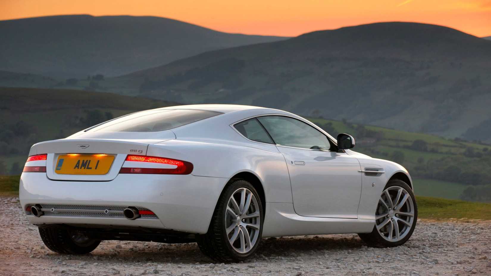 A rear three-quarter shot of a 2005-2012 Aston Martin DB9 Coupe