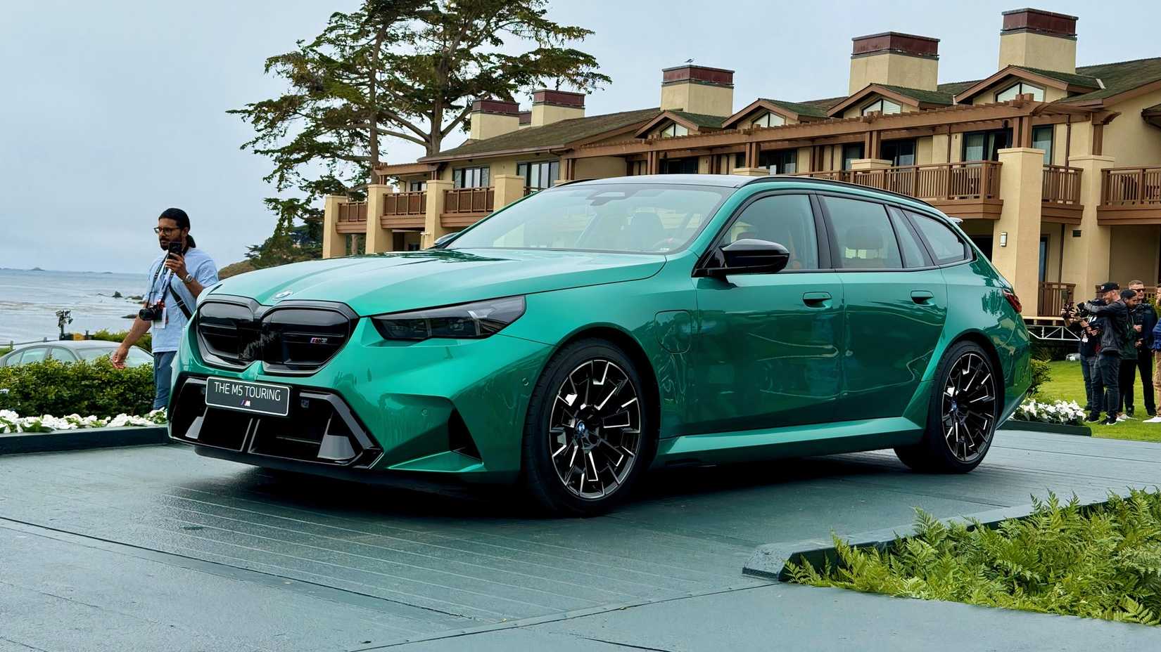 2025 BMW M5 Touring in green parked