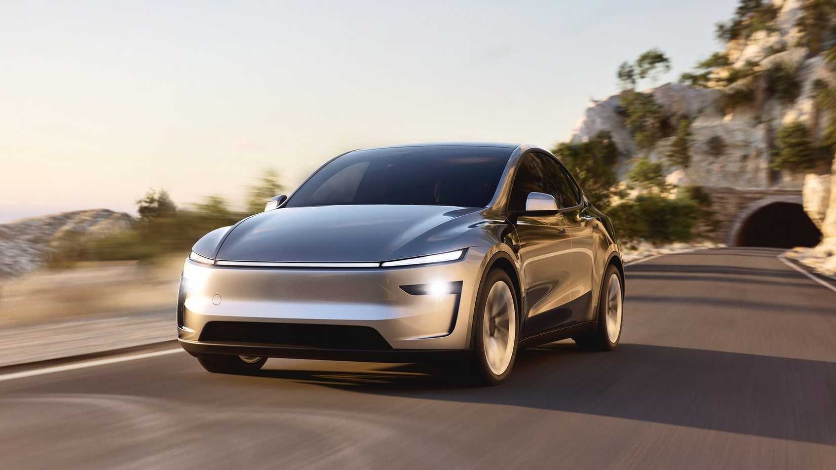 2026 Tesla Model Y Front Angle Driving down highway