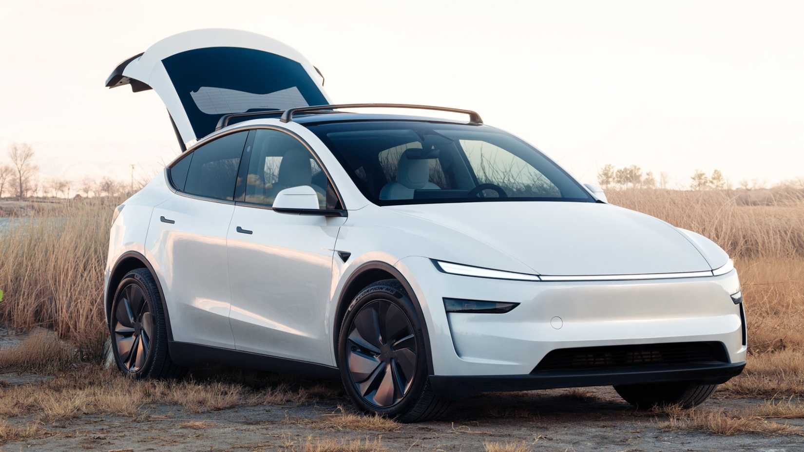 2026 Tesla Model Y White Front Angled View Trunk Open on Dirt