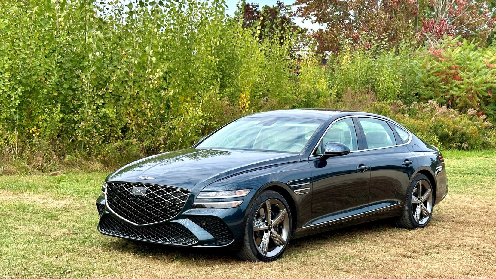 2025 Genesis G80 Black Front Angle Parked in Garden