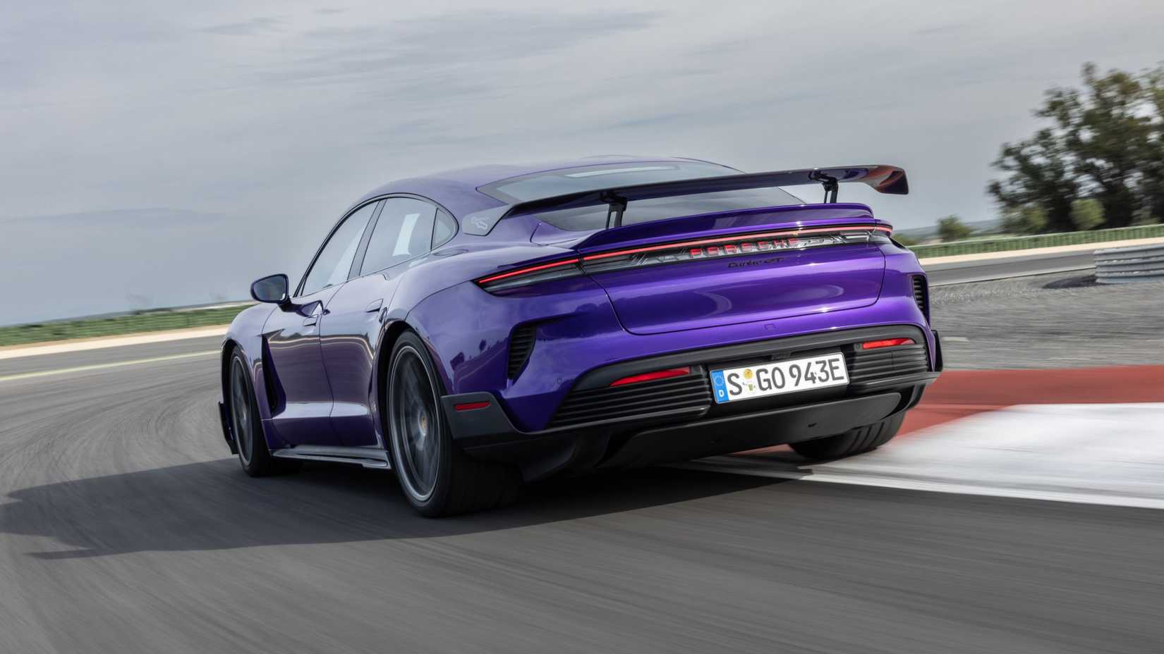 Rear 3/4 action shot ot 2025 Porsche Taycan Turbo GT driving on track