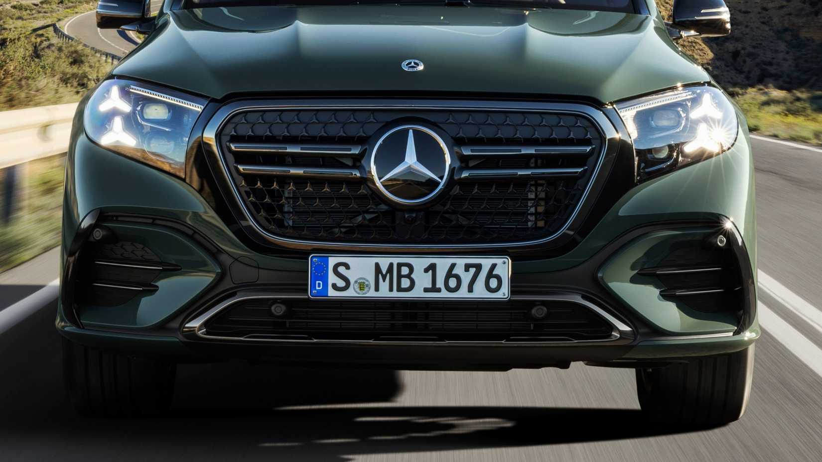 Front close-up of a 2027 Mercedes-Benz GLS 580 driving on the road