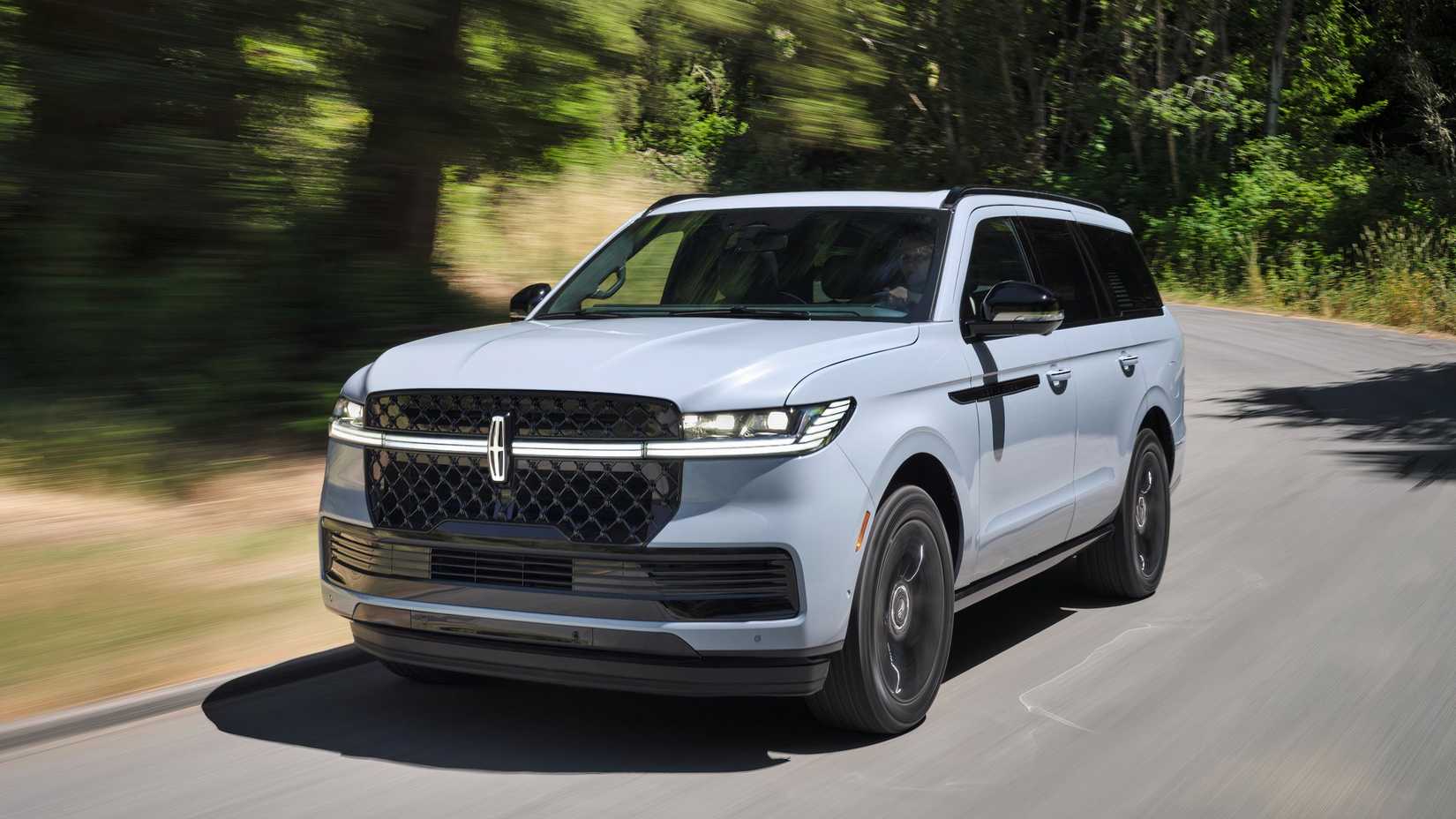 An action shot of the 2025 Lincoln Navigator on a backroad