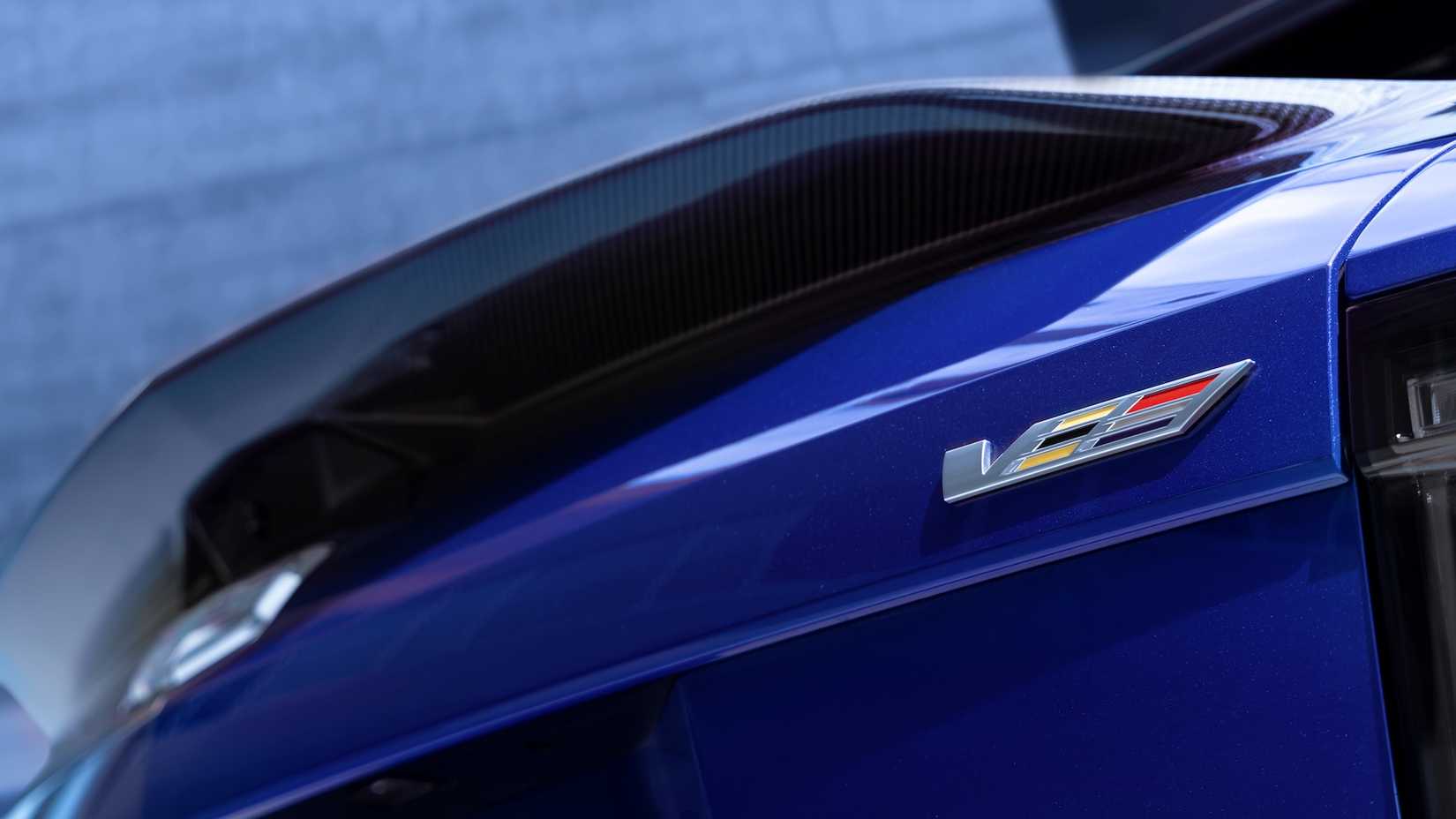 Close-up shot of a 2026 Cadillac Optiq-V badge