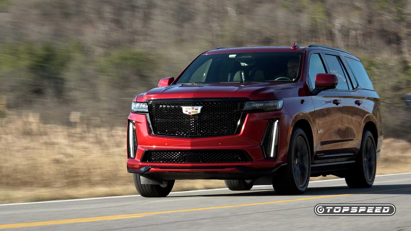 Radiant red Escalade-V dynamic driving image