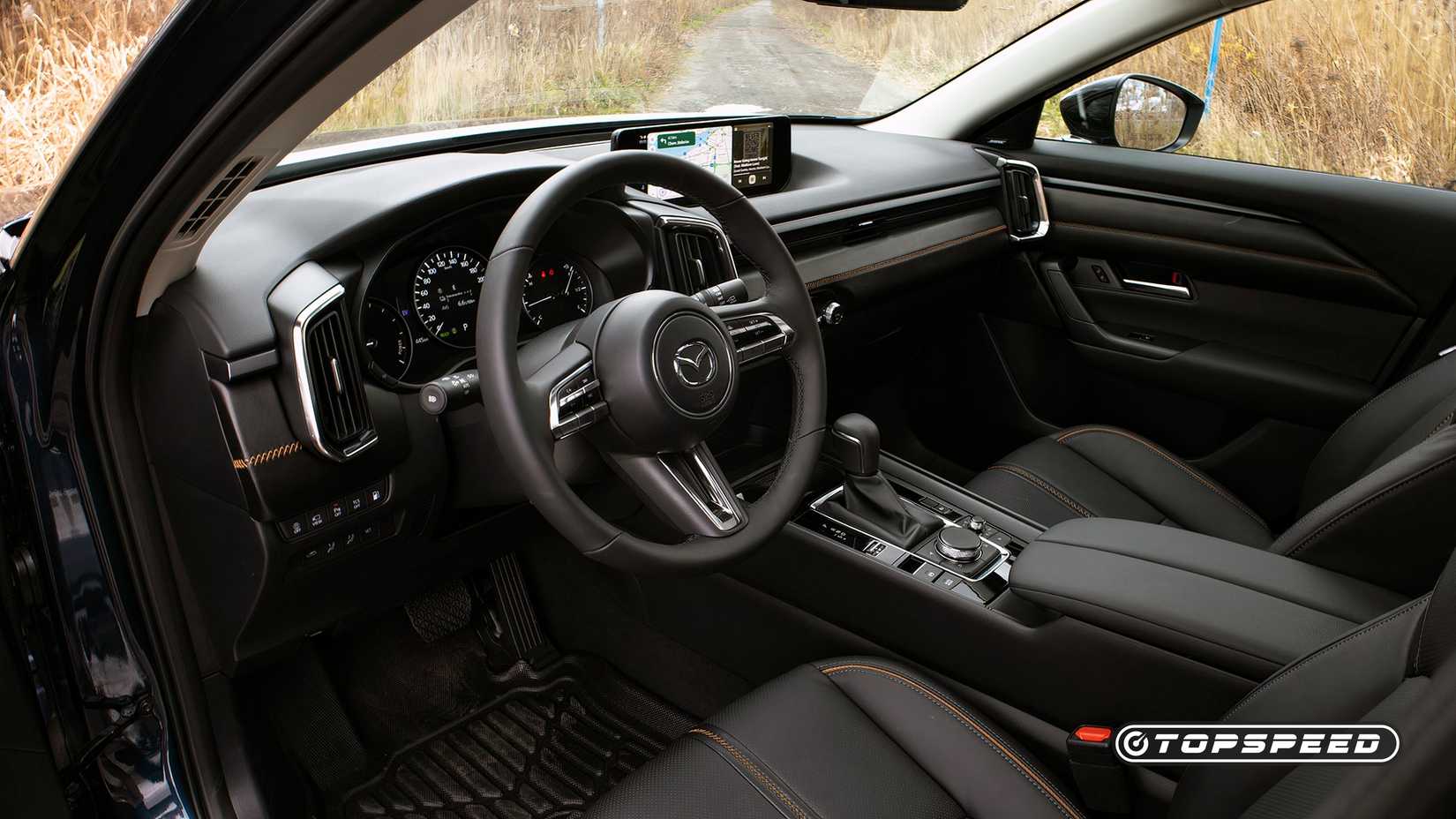 2025 Mazda CX-50 Hybrid Interior Show mostrando bancos dianteiros