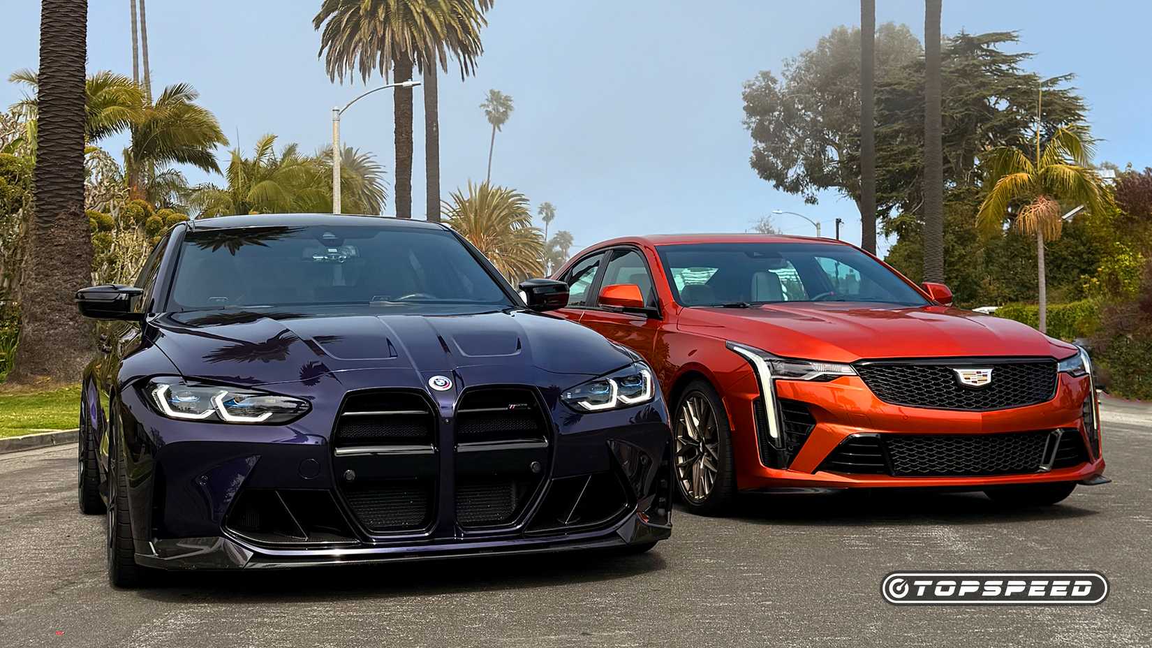 Shot of a BMW M3 and a Cadillac CT4-V Blackwing parked in the road