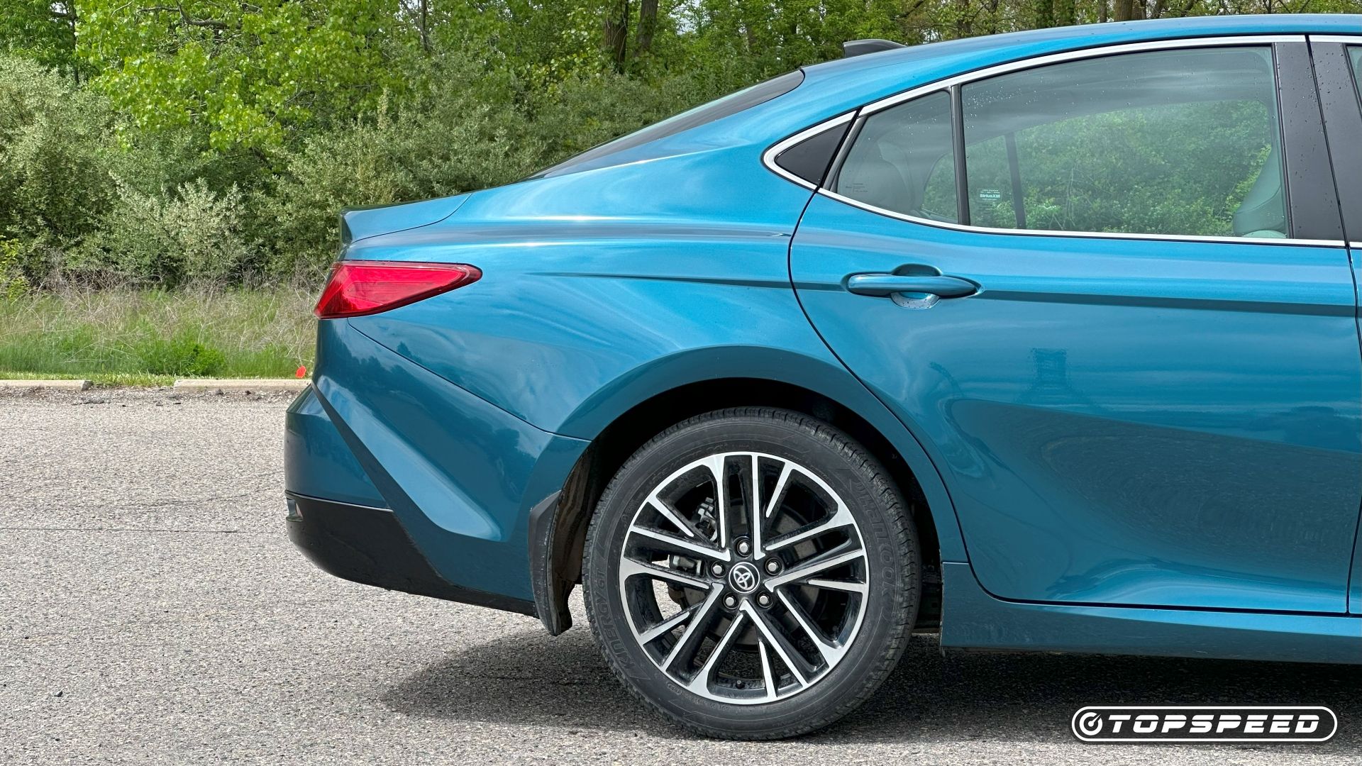 Rear-end shot of a blue 2025 Toyota Camry XLE AWD 