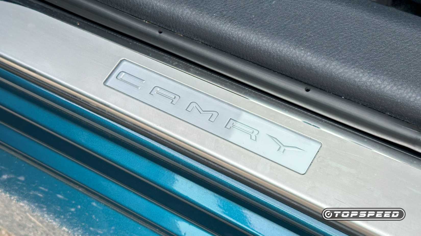 2025 Toyota Camry XLE AWD exterior shot of the Sill Placard