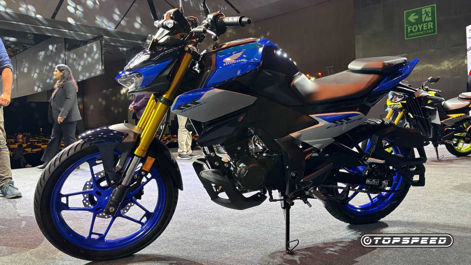 2025 Honda CB125 Hornet Blue Parked On Stage
