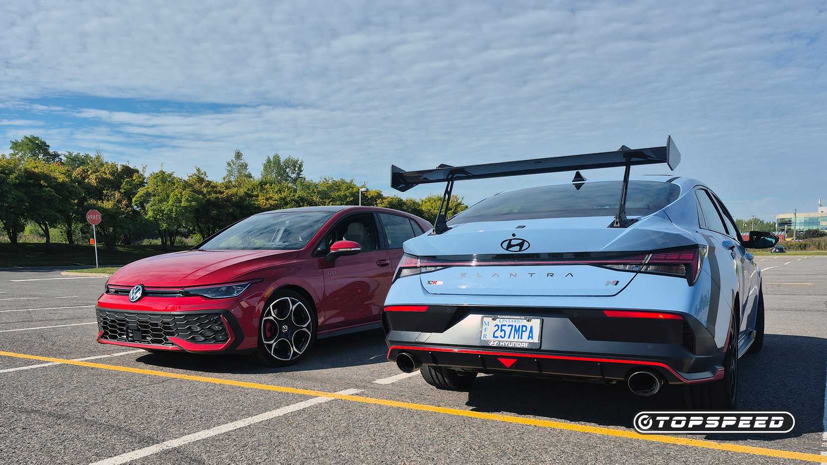 The Hyundai Elantra N and Volkswagen Golf GTI in a performance comparison image