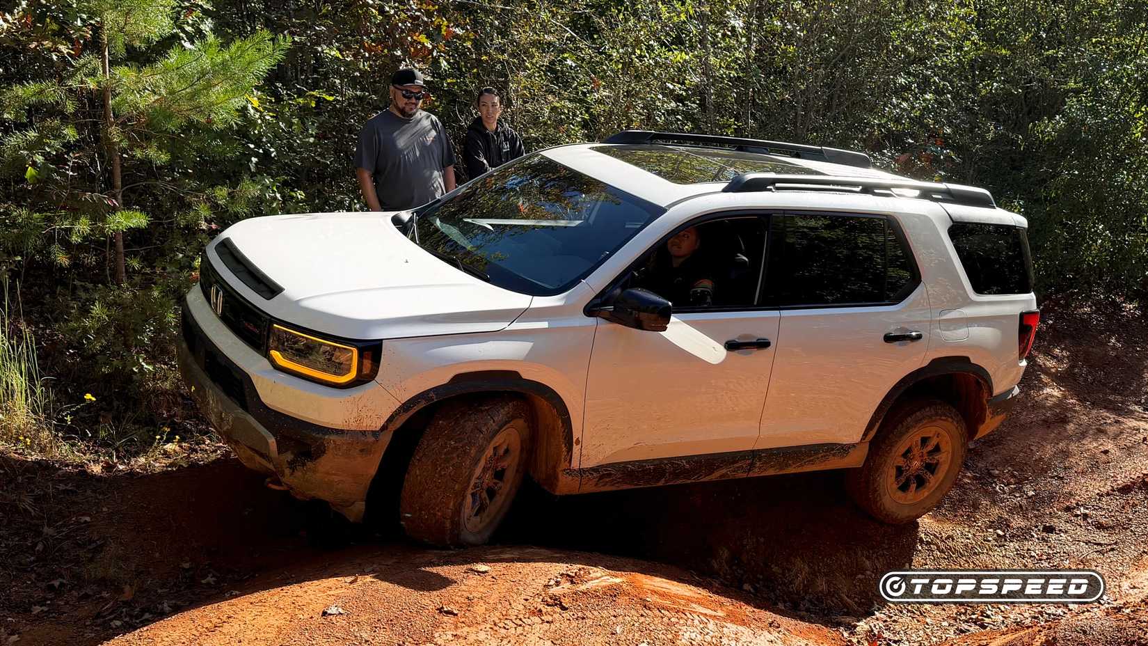 A 2026 Honda Passport TrailSport crawling off road