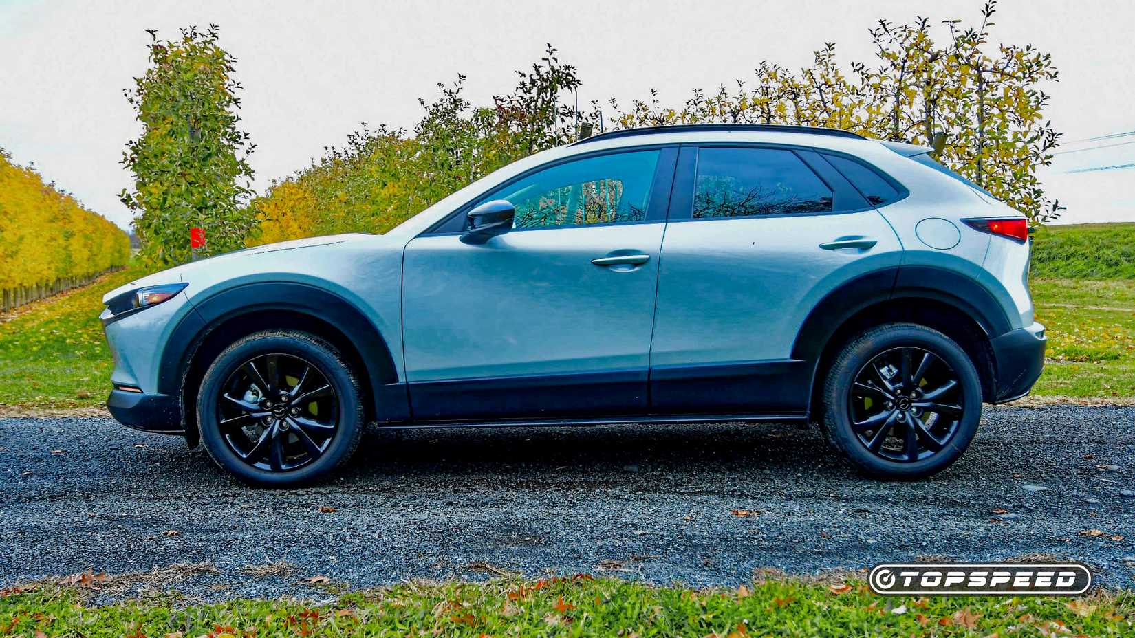 2026 Mazda CX-30 side shot parked in front of trees