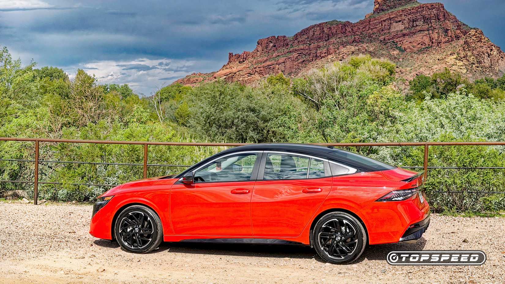 Profile shot of 2026 Nissan Sentra in red parked