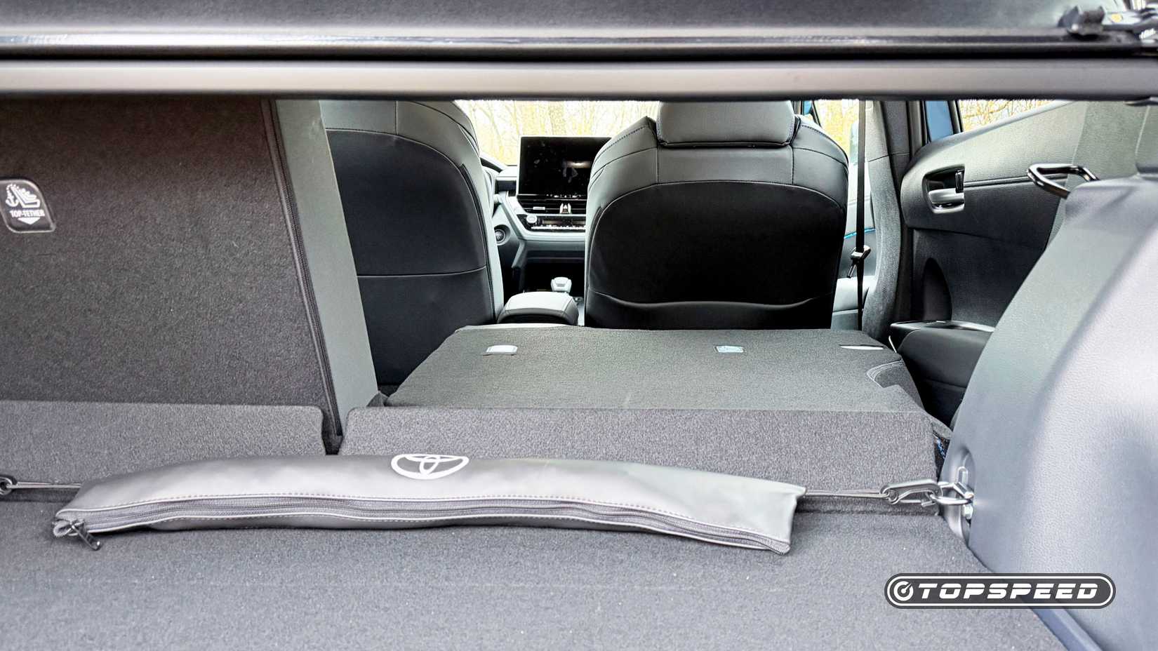 2026 Toyota Corolla Cross interior showing rear-seat pass-through