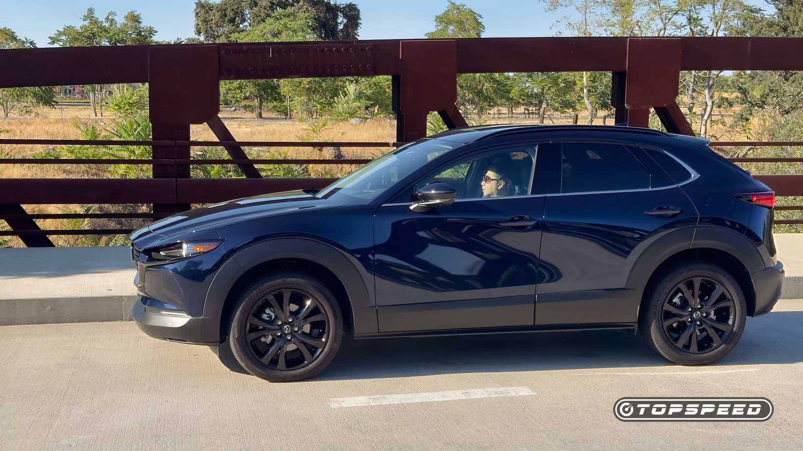 2025 Mazda CX-30 2.5 Turbo Premium Plus left profile parked on bridge