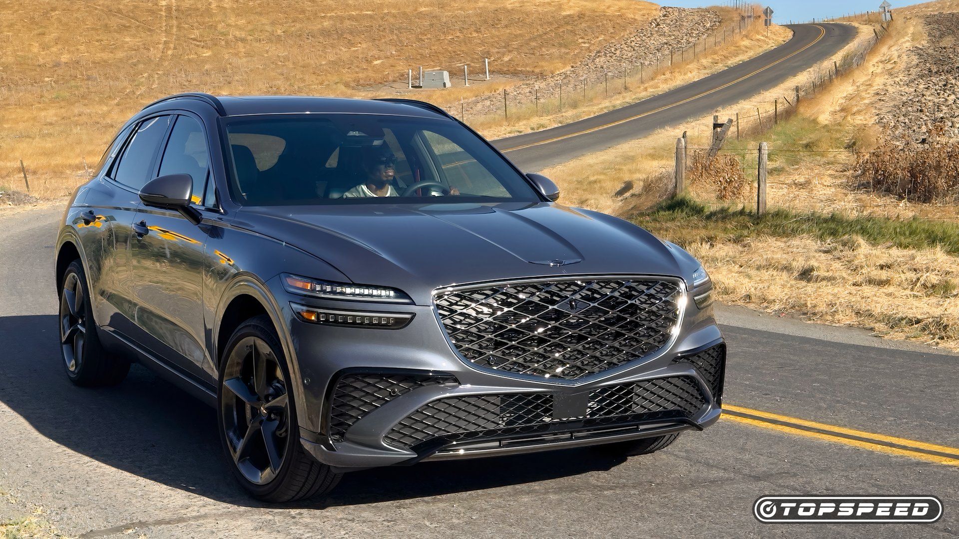 2026 Genesis GV70 3.5T Sport Prestige AWD Exterior Direito Dianteiro 3.25 Na Estrada 