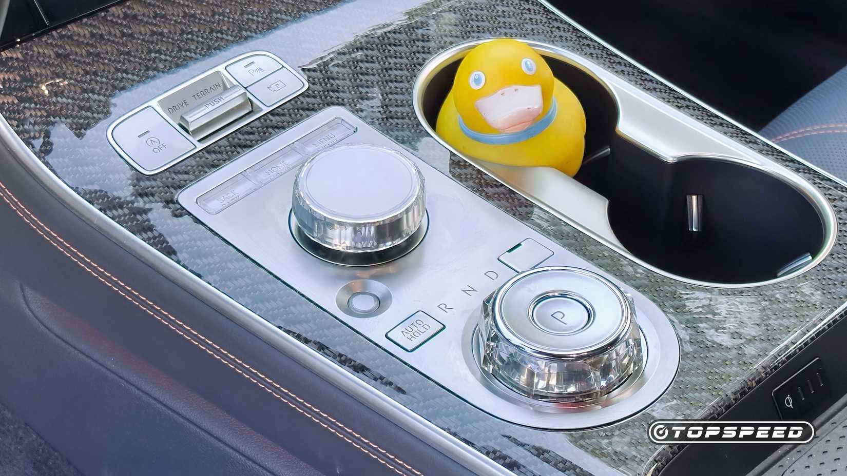 2026 Genesis GV70 3.5T Sport Prestige AWD interior shot showing Center Console Controls Daylight