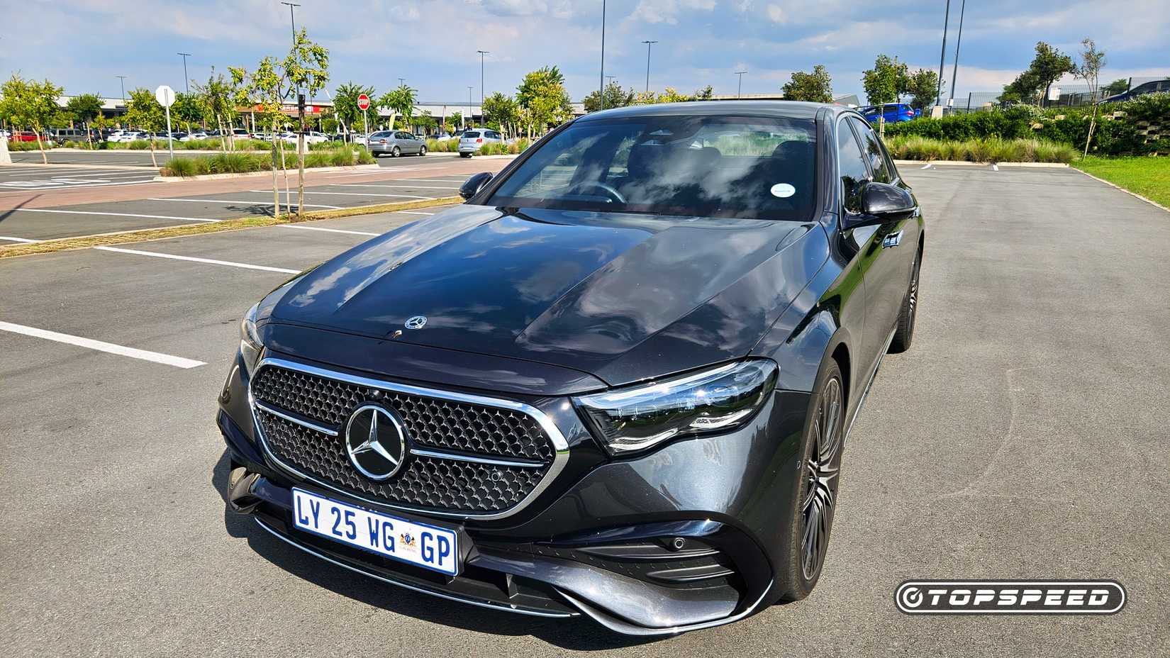 2025 Black Mercedes-Benz E-Class parked in a parking lot ( wide shot )