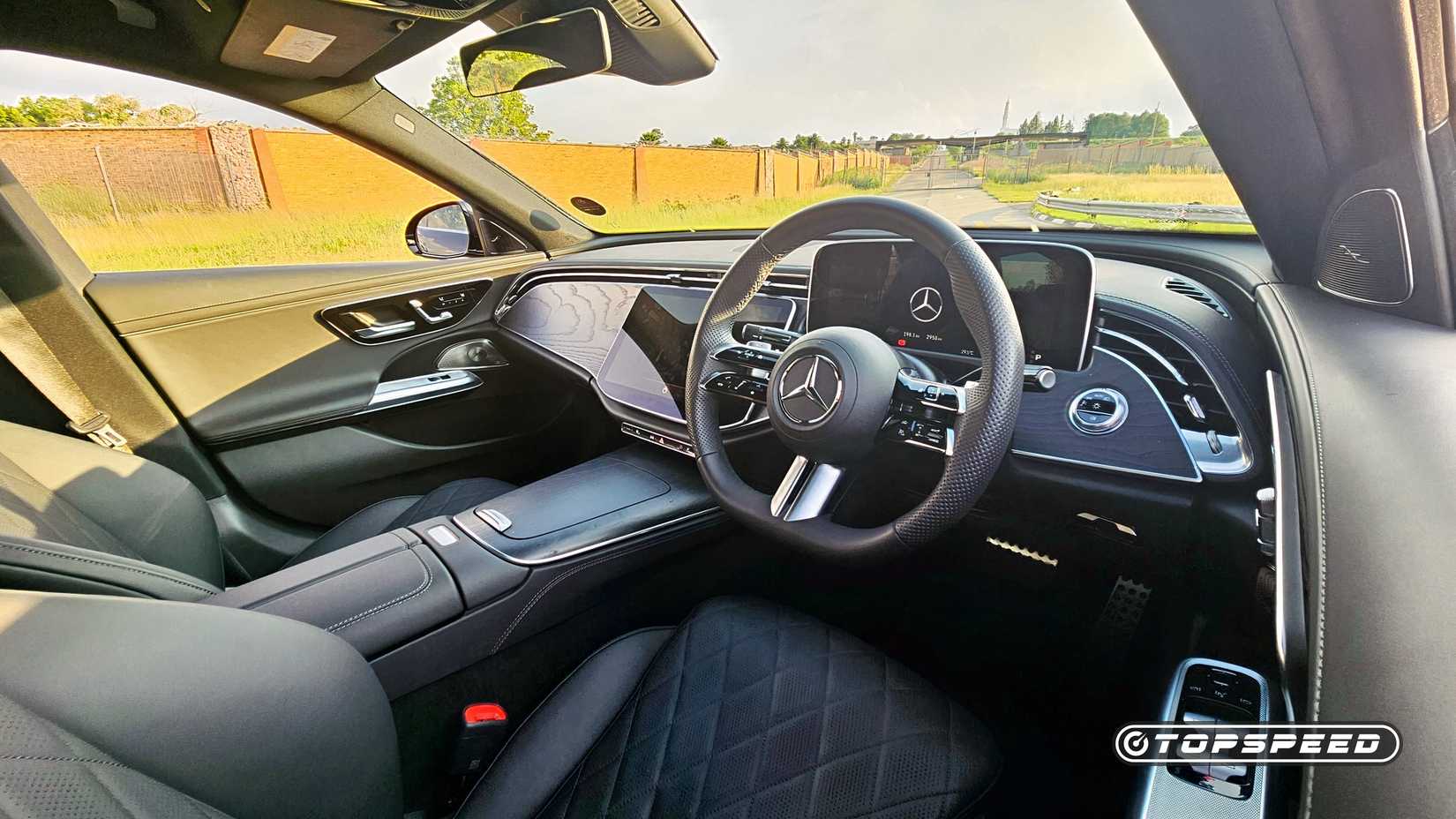 2025 Black Mercedes-Benz E-Class interior shot showing driver's side cabin