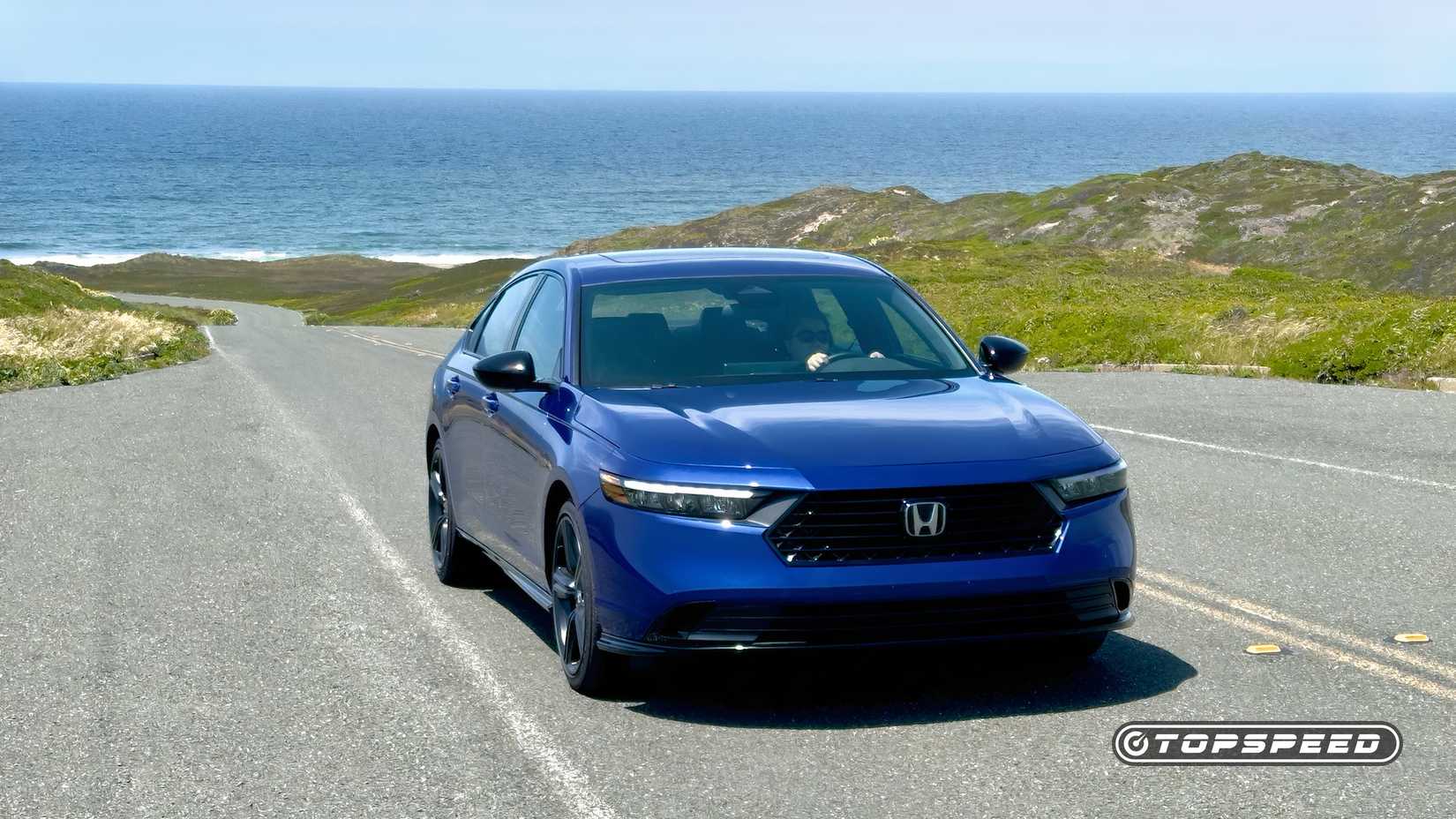 Front shot of a Honda Accord Hybrid parked in a lot
