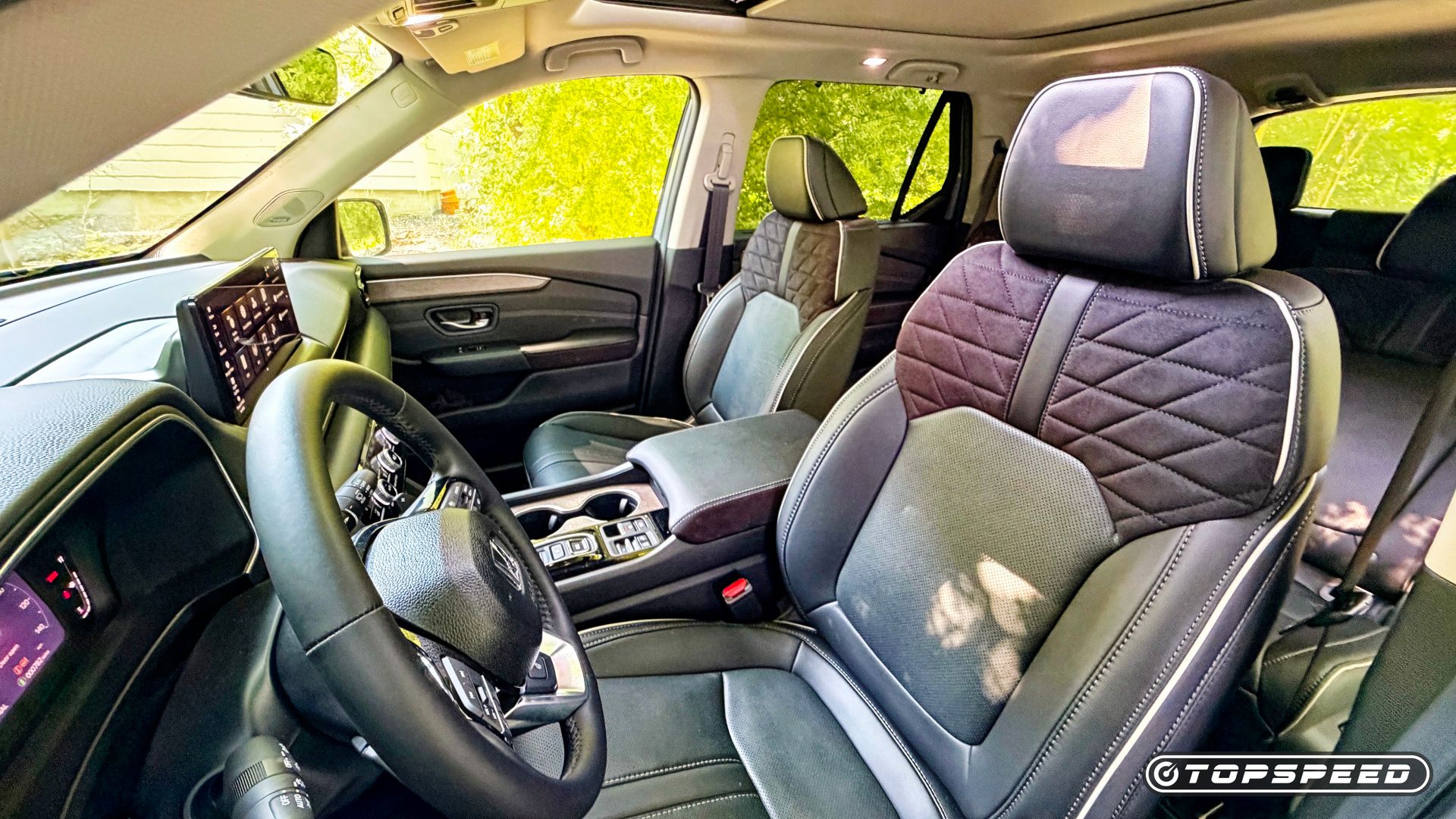 Interior shot of the 2026 Honda Pilot showing the front seats