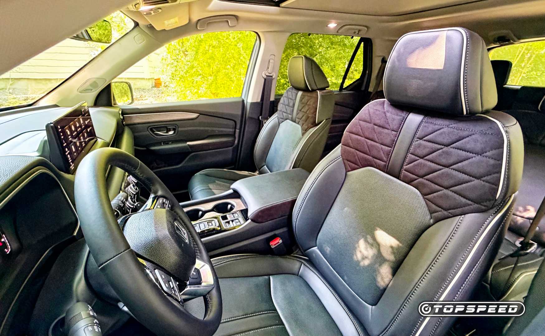 Interior shot of the 2026 Honda Pilot showing the front seats