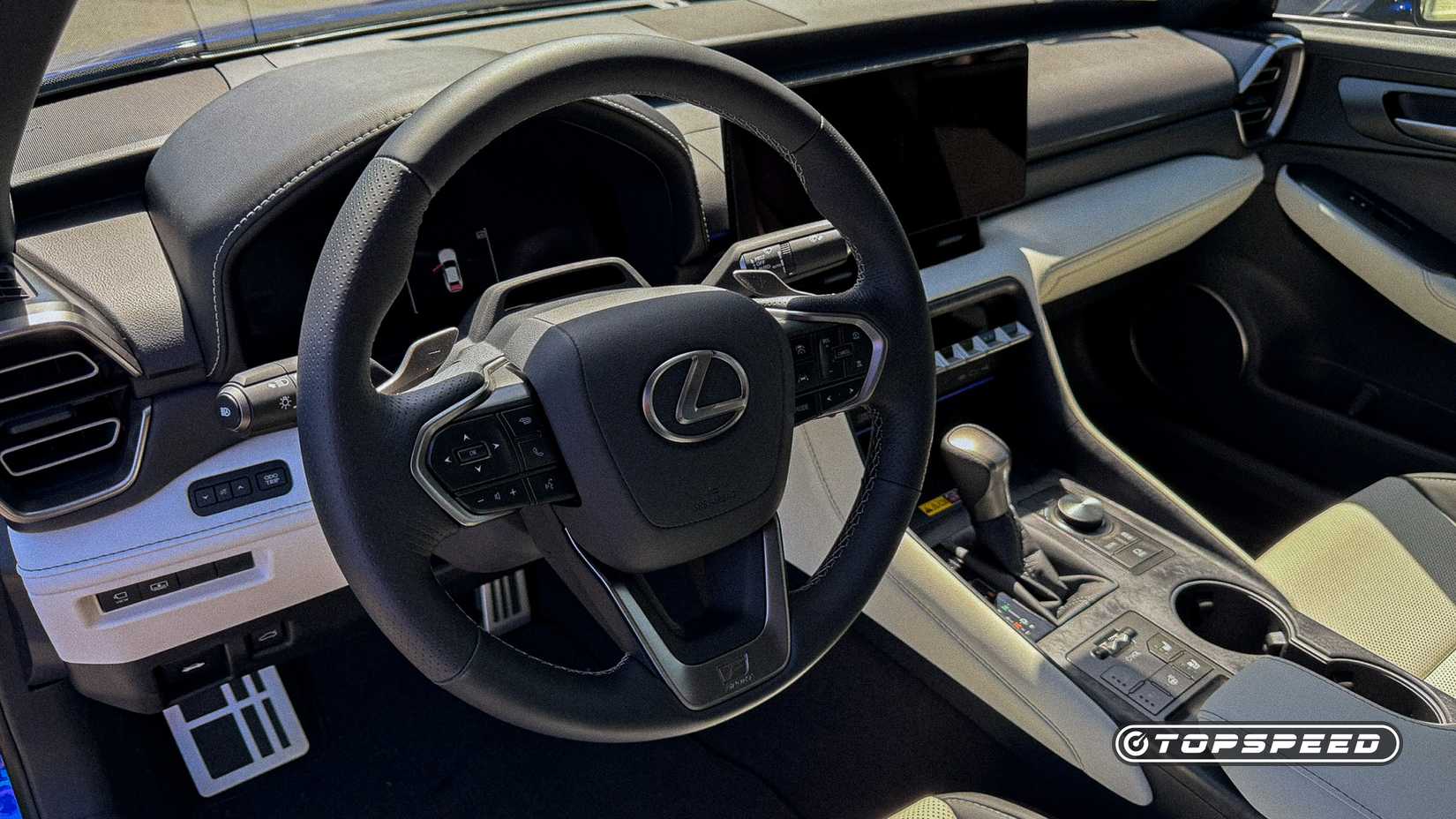 Interior shot of the steering wheel of the 2026 Lexus IS 350 F Sport