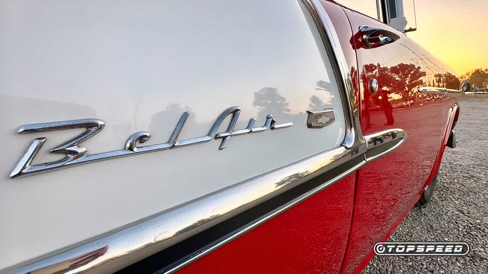 Red and white 1955 Chevy Tri-Five Bel Air badging close-up
